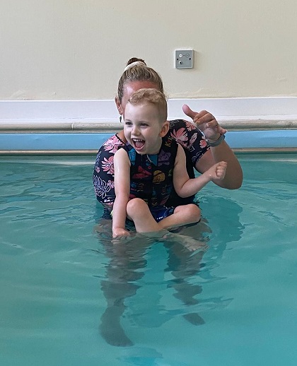 Child receiving specialist paediatric hydrotherapy